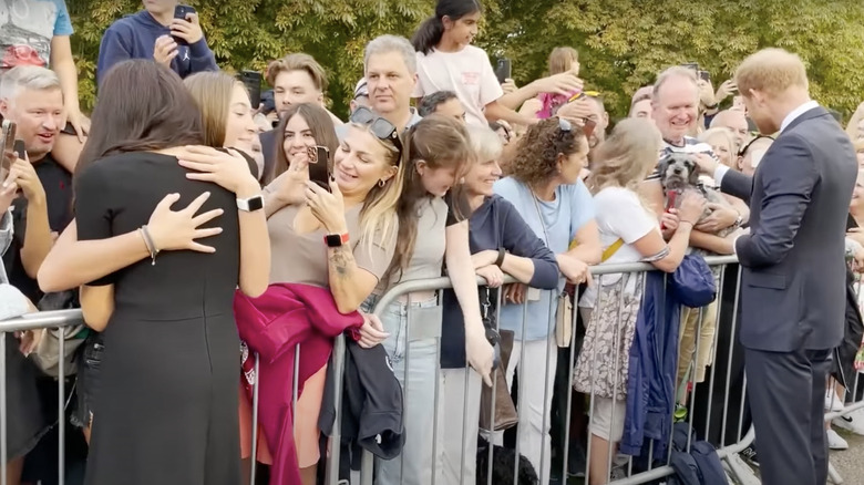 Meghan Markle hugging girl