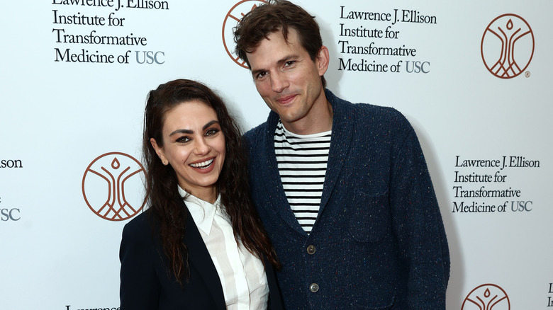 Mila Kunis and Ashton Kutcher smiling