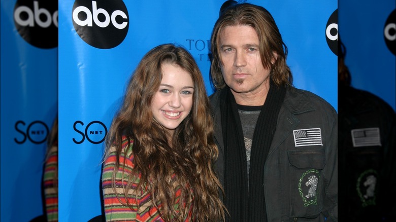 Miley Cyrus smiling with Billy Ray Cyrus