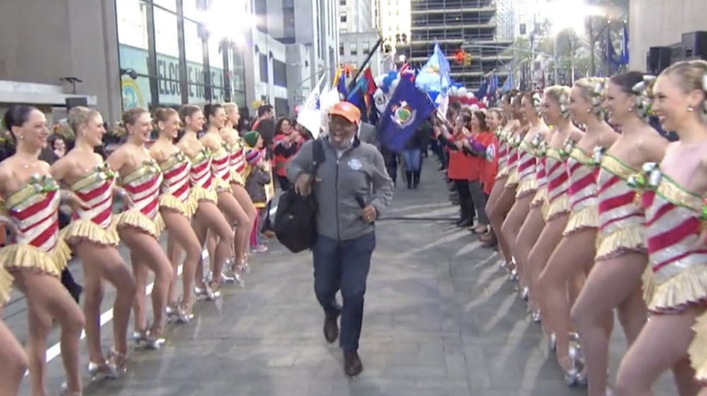 Al Roker jogging, surrounded by The Rocketts