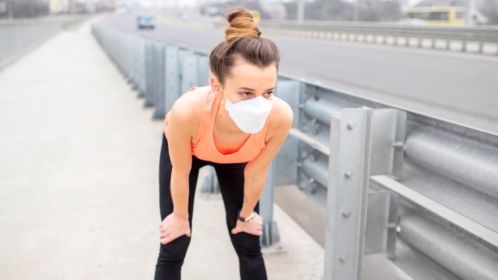 Woman wearing face mask while exercising