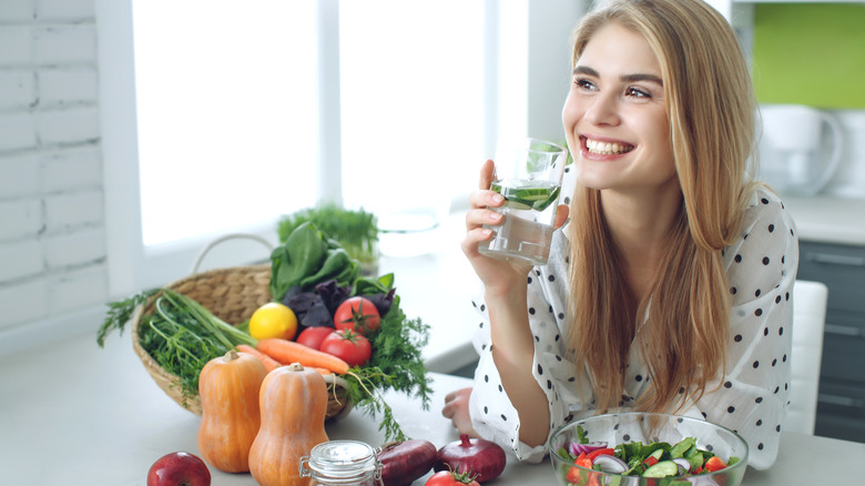 Woman smiling while having a vegan meal