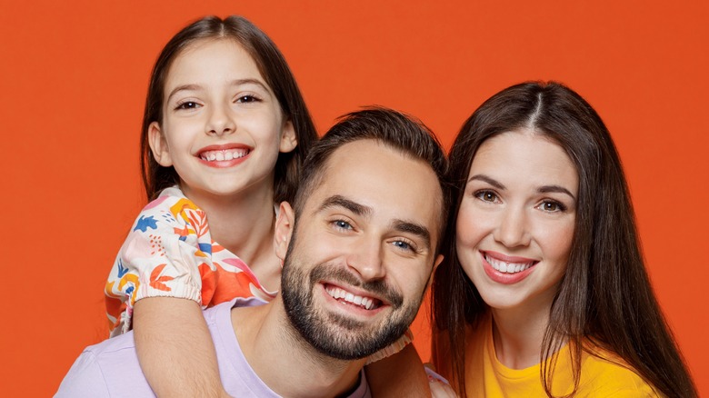 parents with child smiling