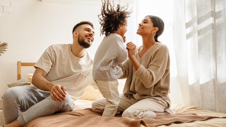 happy family on the bed