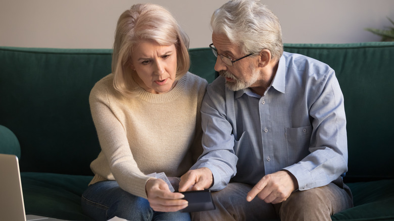 Elderly couple discuss finances