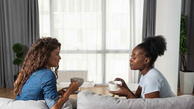 women chatting with tea