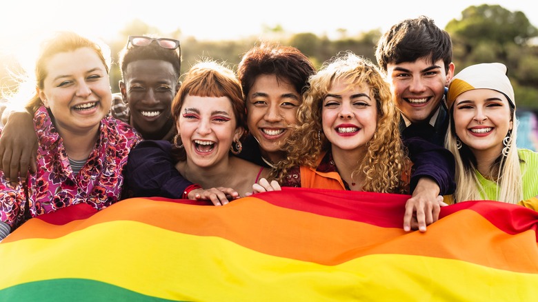 Group of friends with pride flag