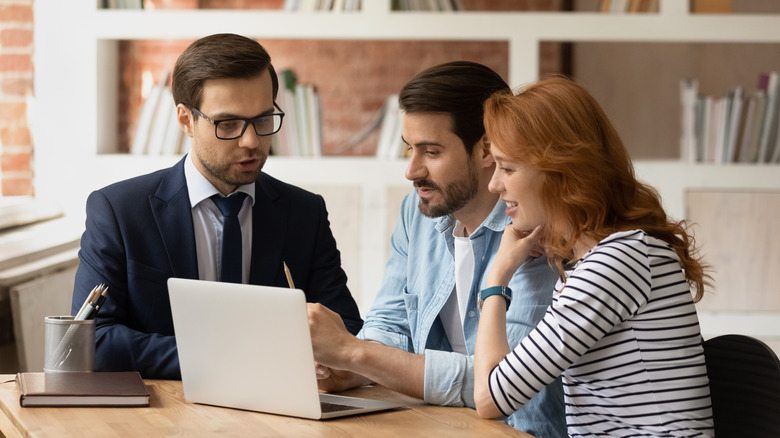 Real estate agent with couple