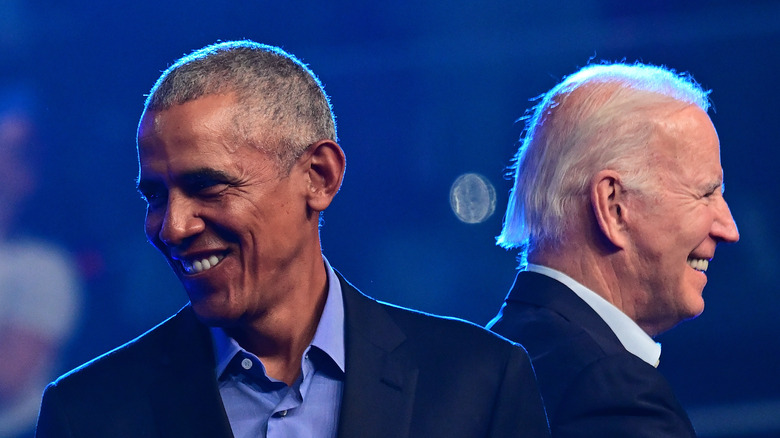 Barack Obama and Joe Biden facing opposite directions