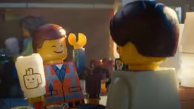 Emmet holding a cup in "The LEGO Movie"