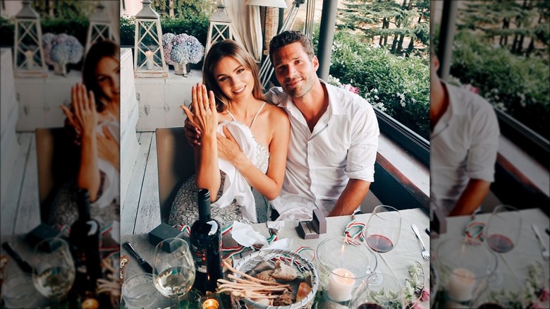 Natalie Pack and Aaron O'Connell posing together at a table