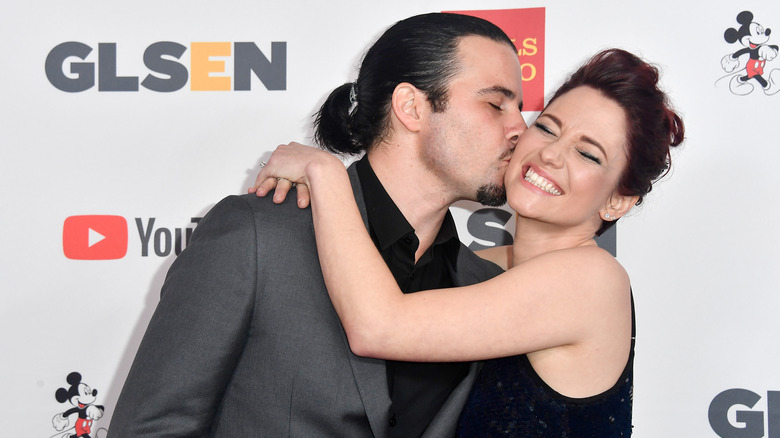 Nathan West kissing wife Chyler Leigh