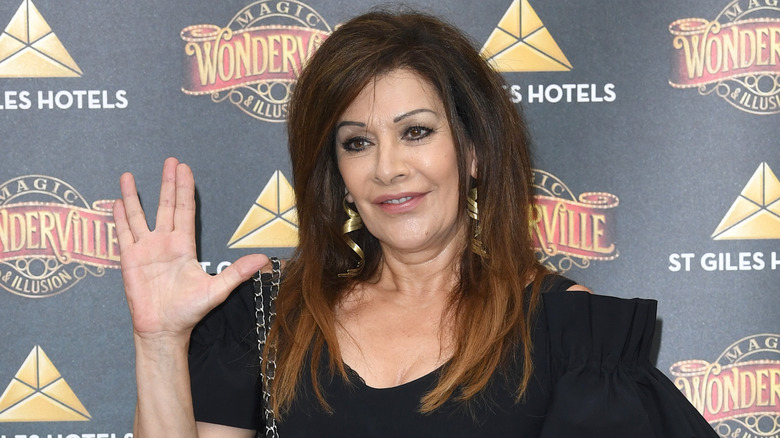 Marina Sirtis giving vulcan salute