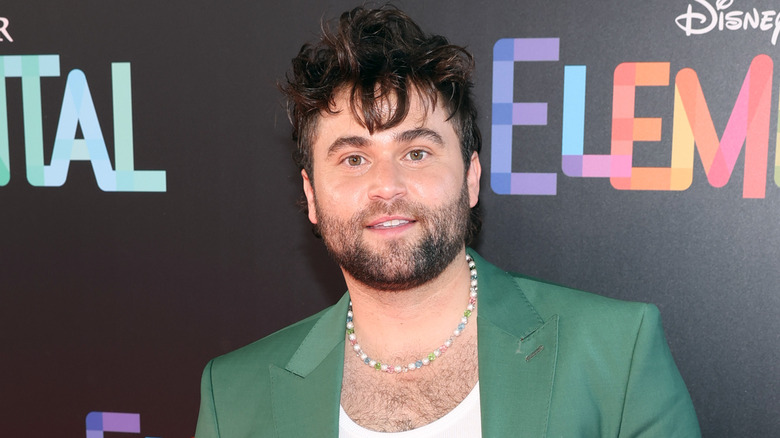 Jake Borelli posing at event