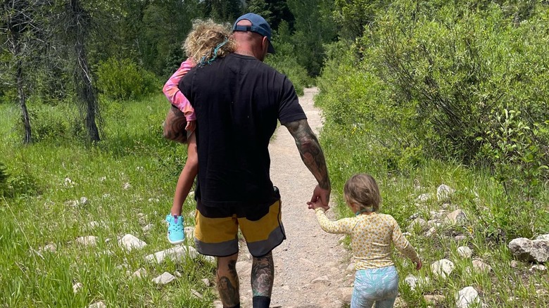 Mike Pyle and his two daughters walking