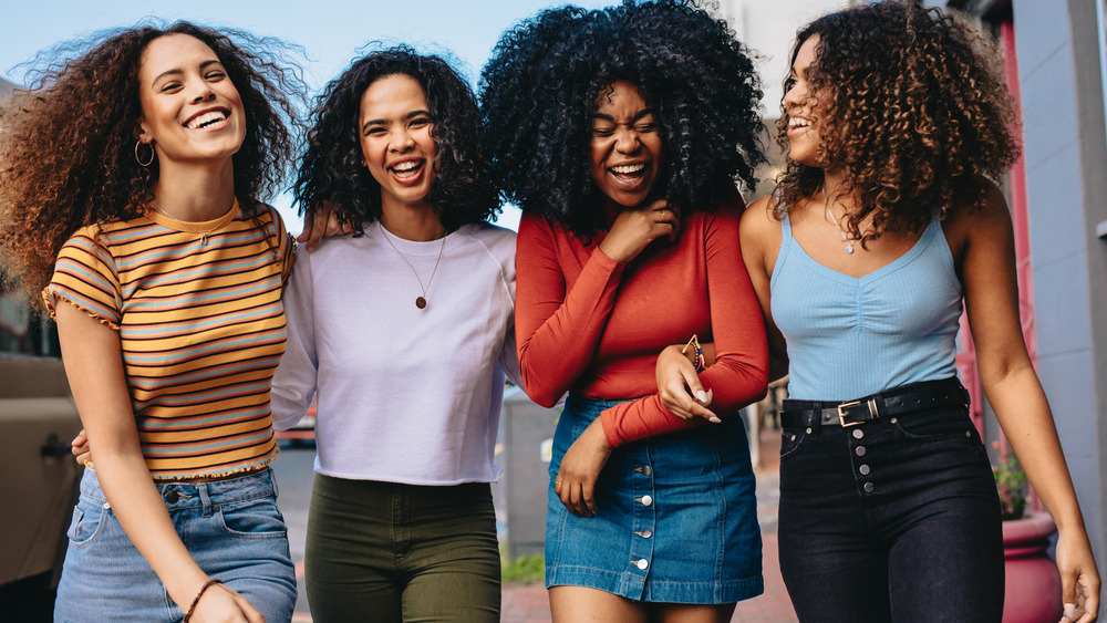 group of women with different curl patterns