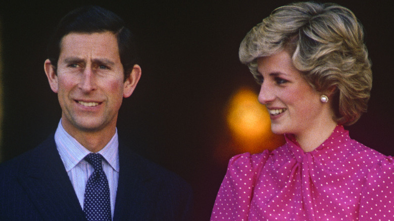Prince Charles and Princess Diana standing next to each other