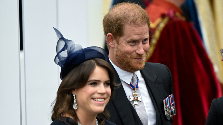 Smiling Princess Eugenie and Prince Harry at King Charles III's 2023 coronation