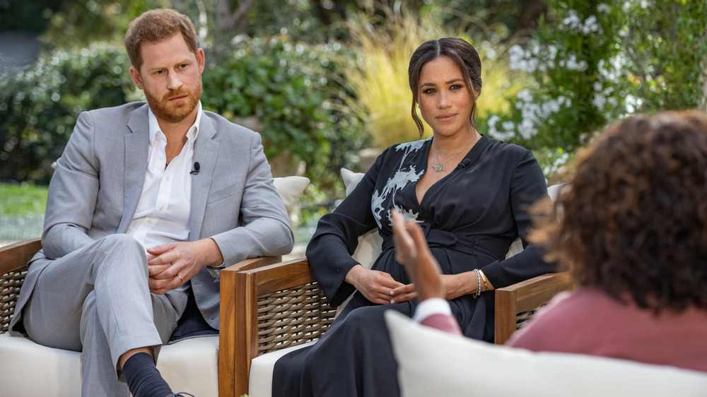 Prince Harry and Meghan Markle talking to Oprah