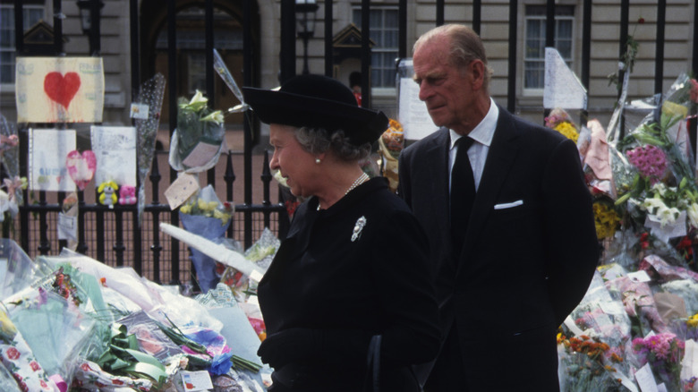 Philip and the Queen walking through Diana tributes 