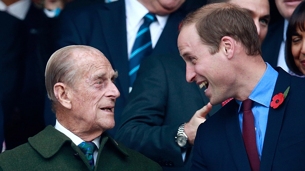 Prince Philip smiling with Prince William