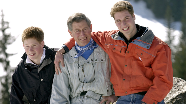 Young Prince Harry, King Charles, and Prince William wearing coats