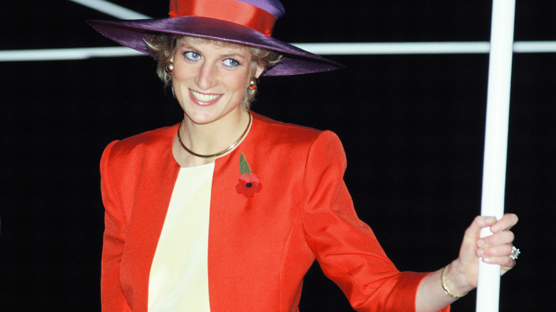 Princess Diana standing on a train