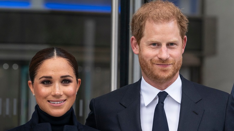 Prince Harry and Meghan Markle smiling