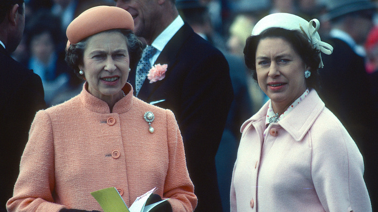 Queen Elizabeth and Princess Margaret at event