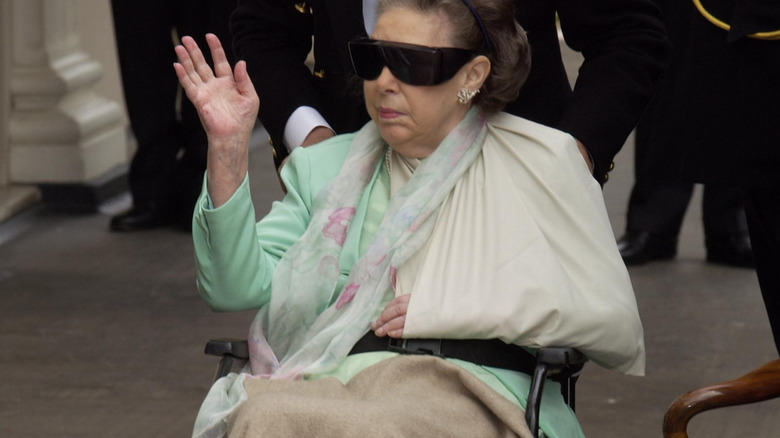 Princess Margaret in a wheelchair wearing sunglasses