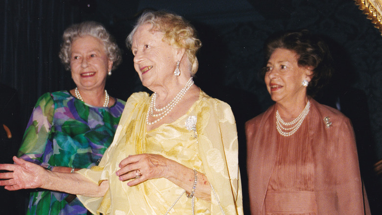 Queen Elizabeth and Princess Margaret with their mother 