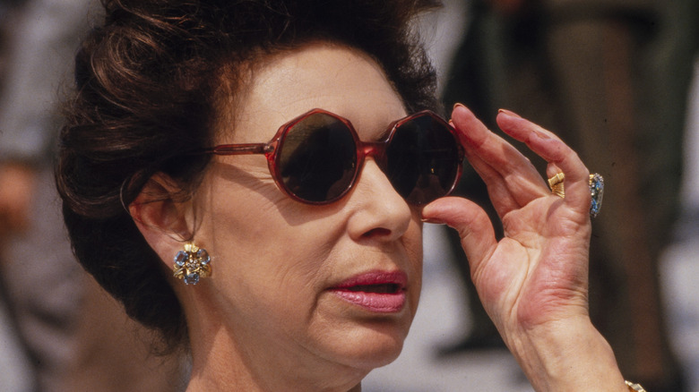 Princess Margaret adjusting her sunglasses