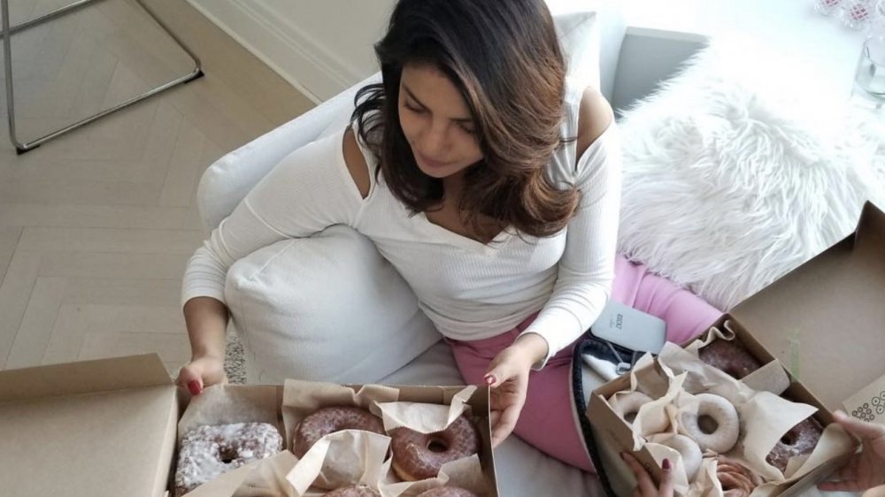 Priyanka Chopra holding box of donuts