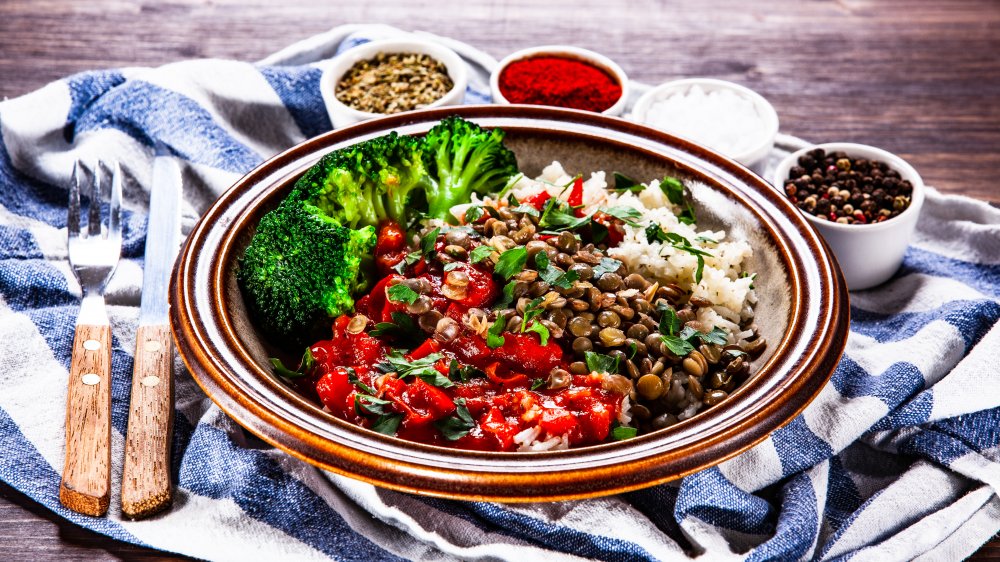 Rice, lentils, and vegetables on a plate with spices, something Priyanka Chopra eats