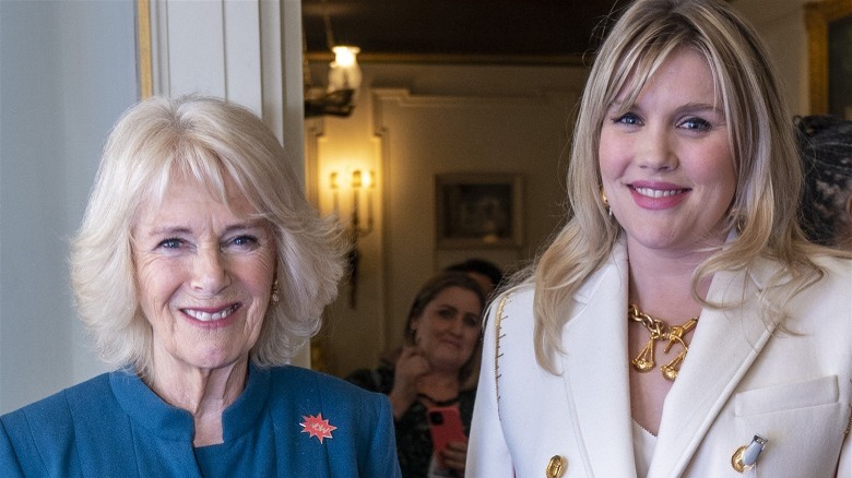 Camilla and Emerald Fennell smiling