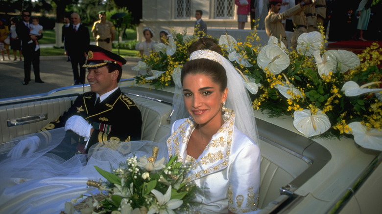 King Abdullah and Queen Rania in car on wedding day