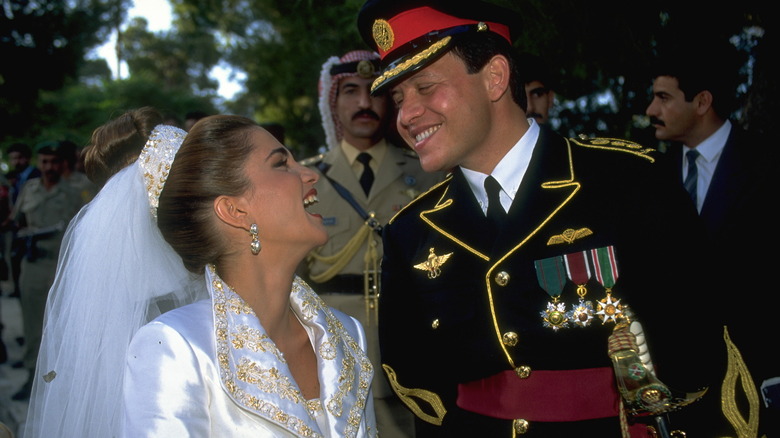 Queen Rania and King Abdullah laughing on wedding day