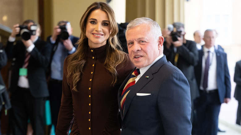 King Abdullah and Queen Rania smiling