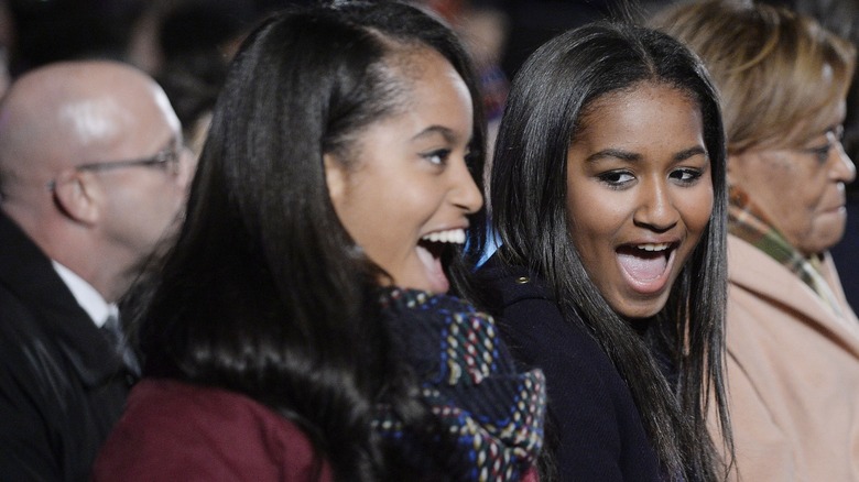 Sasha and Malia Obama smiling