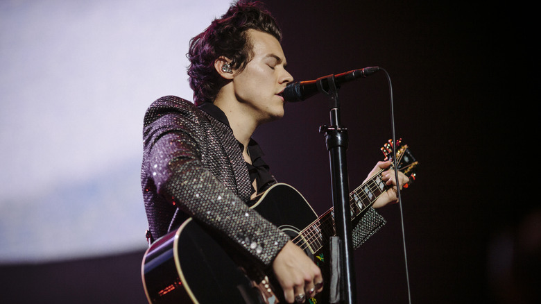 Harry Styles performing on stage