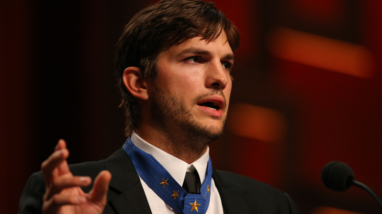 Ashton Kutcher speaking at a fundraiser