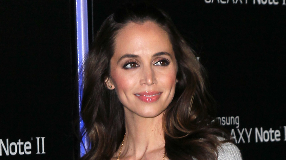 Eliza Dushku wearing a white sweater