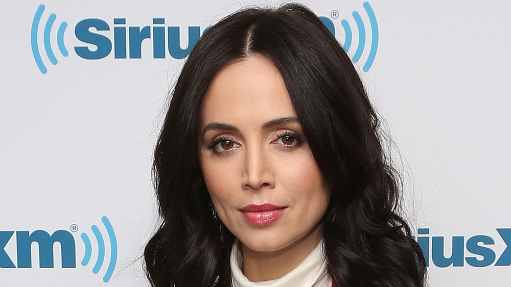 Eliza Dushku wearing a white turtleneck