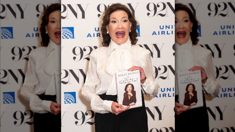 Kelly Bishop holding her memoir