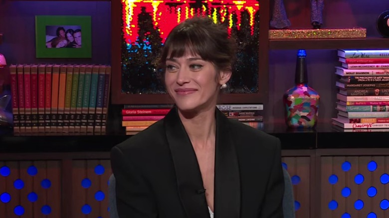 Lizzy Caplan smiling in the Bravo clubhouse