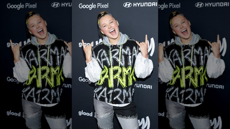 JoJo Siwa in a Karma hoodie