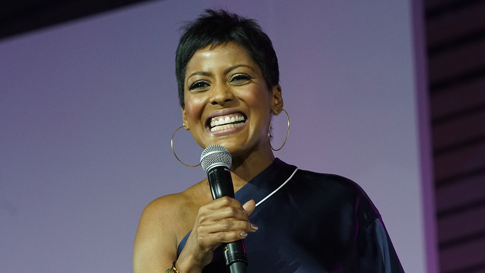 Tamron Hall speaking into a mic