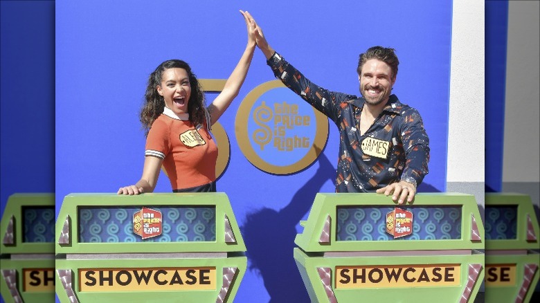 Two people high-fiving on the final showcase at The Price is Right