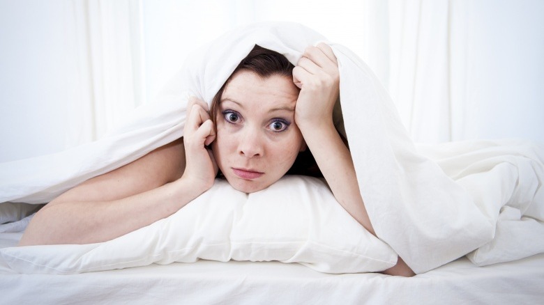 woman unable to sleep insomnia