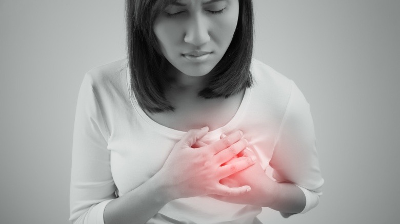 woman with heart pain strain